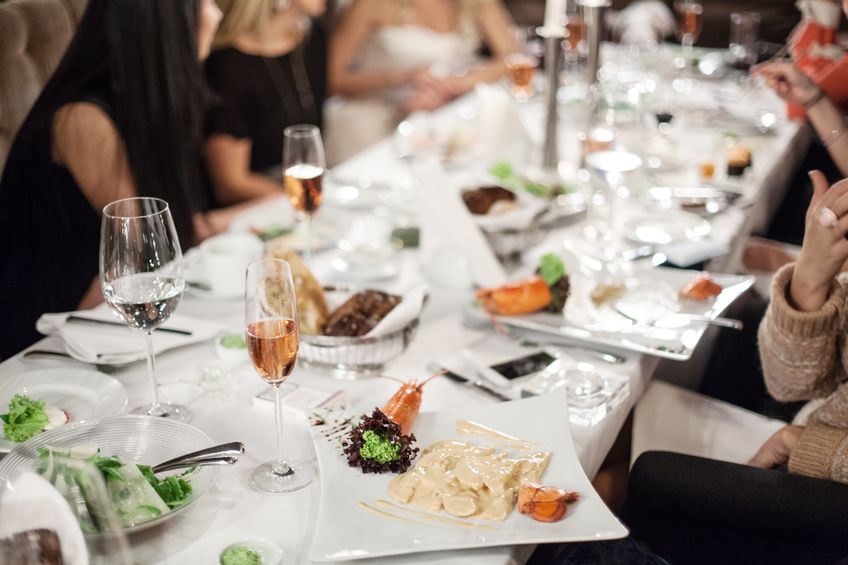 Delicious corporate catering table with staff